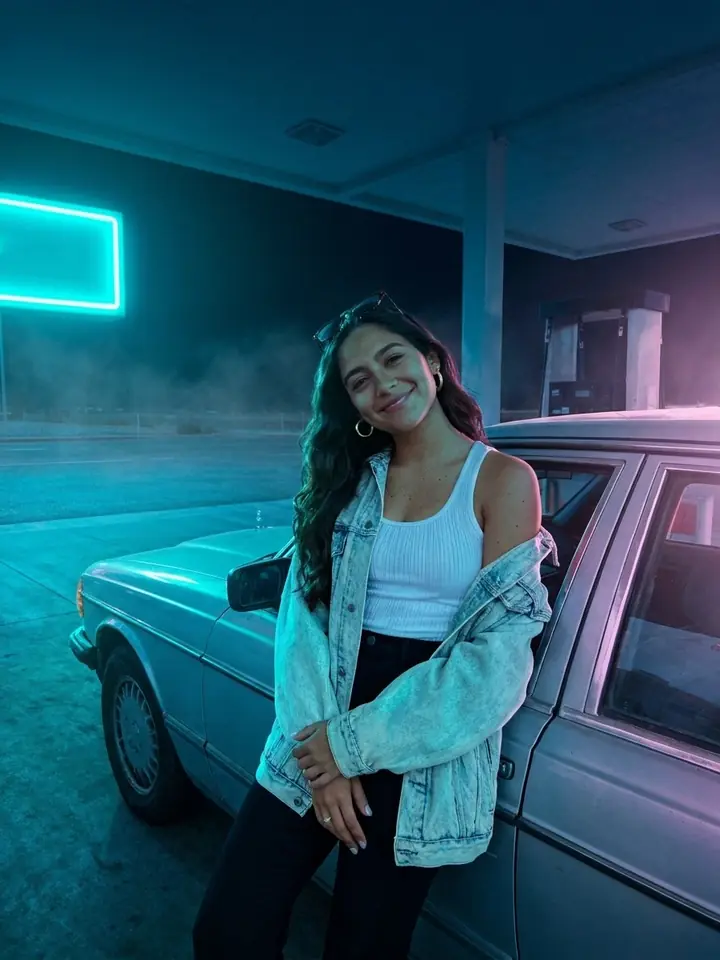 The same photo re-shot in the Neon blue look: cyan and pink neon light after dark